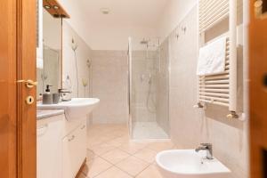 a bathroom with a sink toilet and a shower at Spacious Apartment 600 mt to Metro M3 Comasina in Milan +17 photos