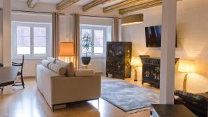 a living room with a couch and a fireplace at Ferienwohnung Silvia in Villingen-Schwenningen