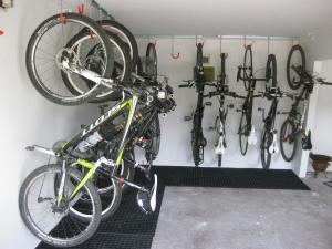 a bike is hanging on a wall with other bikes at Action Forest Hotel Titisee - nähe Badeparadies in Titisee-Neustadt