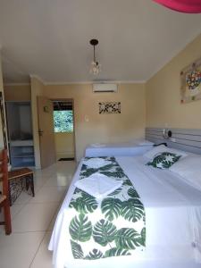 Cama ou camas em um quarto em Hotel Rio Penedo