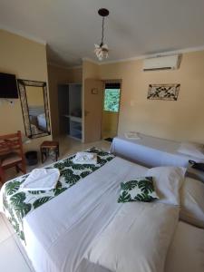 Cama ou camas em um quarto em Hotel Rio Penedo