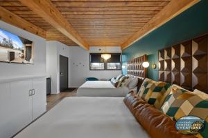 a bedroom with a couch and a bed in a room at The Eastpoint Suite #1 in Lake Geneva