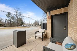a chair sitting on a patio next to a building at The Eastpoint Suite #1 in Lake Geneva