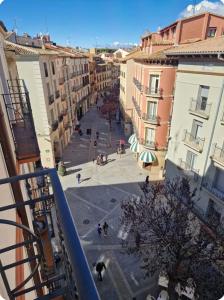 a view of a street in a city with buildings at Gran piso en el centro de Huesca in Huesca +8 photos