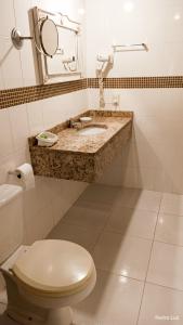 Um banheiro em Hotel Rio Penedo