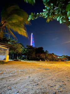 a tall building with a blue light on it at Casa LAGOMAR in Puerto Colombia
