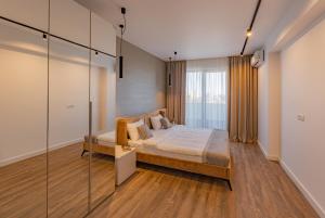 En eller flere senge i et værelse på Cavar Aparthotel