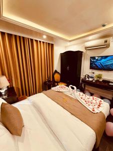 Postel nebo postele na pokoji v ubytování Majestik Hotel