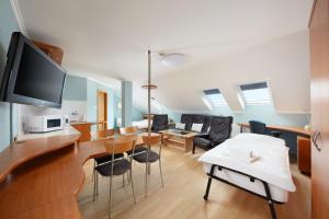 TV a/nebo společenská místnost v ubytování Hotel Nikolas