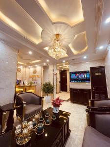 TV a/nebo společenská místnost v ubytování Majestik Hotel