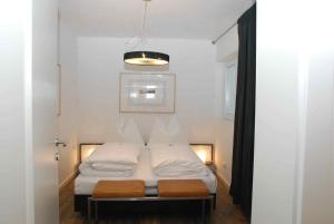 Postel nebo postele na pokoji v ubytování Arnsteiner Apartments