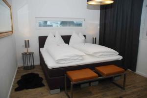 Postel nebo postele na pokoji v ubytování Arnsteiner Apartments