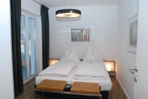 Postel nebo postele na pokoji v ubytování Arnsteiner Apartments