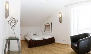 Postel nebo postele na pokoji v ubytování Arnsteiner Apartments