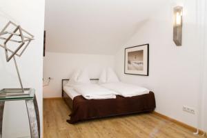 Postel nebo postele na pokoji v ubytování Arnsteiner Apartments