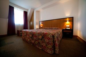 Postel nebo postele na pokoji v ubytování Hotel Bagoeira