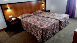 Postel nebo postele na pokoji v ubytování Hotel Bagoeira