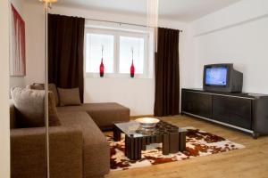 TV a/nebo společenská místnost v ubytování Arnsteiner Apartments