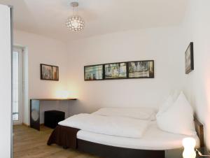 Postel nebo postele na pokoji v ubytování Arnsteiner Apartments