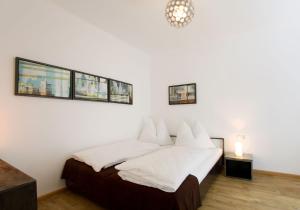Postel nebo postele na pokoji v ubytování Arnsteiner Apartments