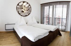 Postel nebo postele na pokoji v ubytování Arnsteiner Apartments