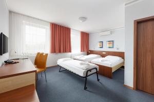 Postel nebo postele na pokoji v ubytování Hotel Nikolas