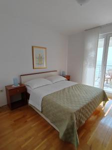 Postel nebo postele na pokoji v ubytování Villa Noa Mimice
