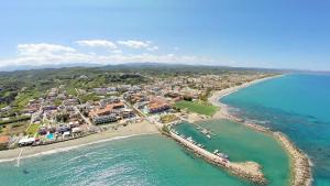 an aerial view of a beach and the ocean at Porto Platanias Beach Resort & Spa in Platanias