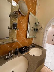 a bathroom with a sink and a mirror at Luxury studio next to Quba استديو قباء in Al Madinah +6 photos
