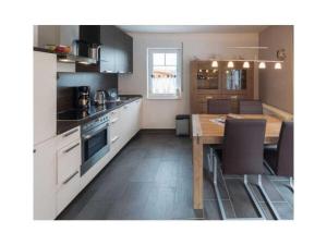 Kuchyň nebo kuchyňský kout v ubytování Holiday apartment Meerestraum