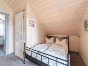 Ένα ή περισσότερα κρεβάτια σε δωμάτιο στο Ferienhaus mit toller Ausstattung