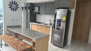 Kuchyň nebo kuchyňský kout v ubytování Apartamento de Descanso en Ricaurte - Girardot