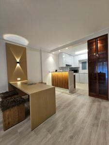a living room with a table and a kitchen at Sheraton Ocean 103 - Without Pool access in Cairo