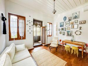 a living room with a couch and a table at MacraHouse in Fethiye