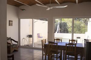 a dining room with a table and chairs at C9 Casas la colmena a 3 min playa alberca 2 rec. in La Peñita de Jaltemba