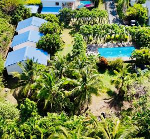 an aerial view of a resort with a swimming pool at Domaine De Grande Terre in Saint-François