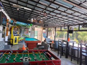 a billiard room with a pool table and a bar at Hotel Bungalows La Era in Ixtapan de la Sal