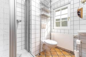 Ένα μπάνιο στο Ferienhaus Urlaubshus +24 φωτογραφίες