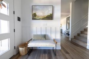 a room with a chair and a painting on the wall at The Copperleaf Flagstaff Escape in Flagstaff