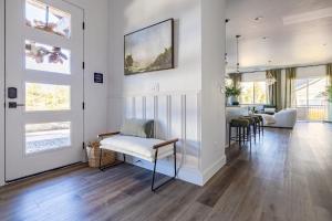 a living room with white walls and wooden floors at The Copperleaf Flagstaff Escape in Flagstaff +70 photos