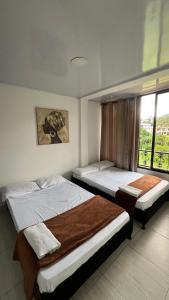 Postel nebo postele na pokoji v ubytování Apartamentos Family