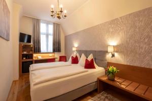 Posteľ alebo postele v izbe v ubytovaní Hotel Mader