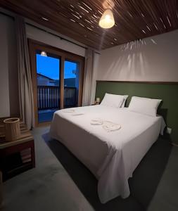 Ένα ή περισσότερα κρεβάτια σε δωμάτιο στο Casa dos Pássaros - AR Condicionado nos dois quartos