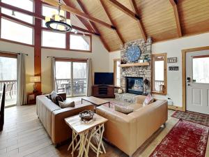 a living room with a couch and a fireplace at Howling Wolf Den in Oakland