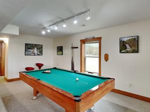 a billiard room with a pool table in it at Howling Wolf Den in Oakland