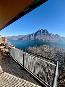 a view of crater lake from the balcony of a house at Appartamento sul Lago con Terrazza Panoramica in Riva di Solto