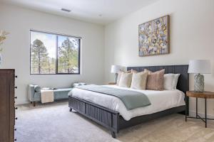a bedroom with a large bed and a window at Home with Studio near Pine Canyon in Flagstaff
