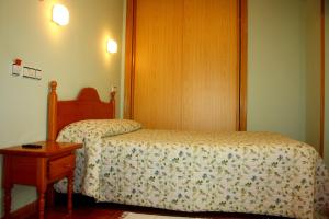 Cama o camas de una habitación en Hostal La Granja