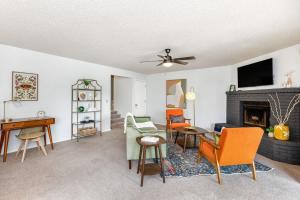 a living room with a couch and a fireplace at Mid-Century Flagstaff Mtn Condo in Flagstaff