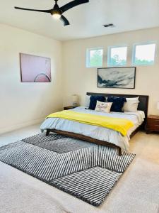 a bedroom with a king sized bed with a rug at Flagstaff Home Near NAU in Flagstaff